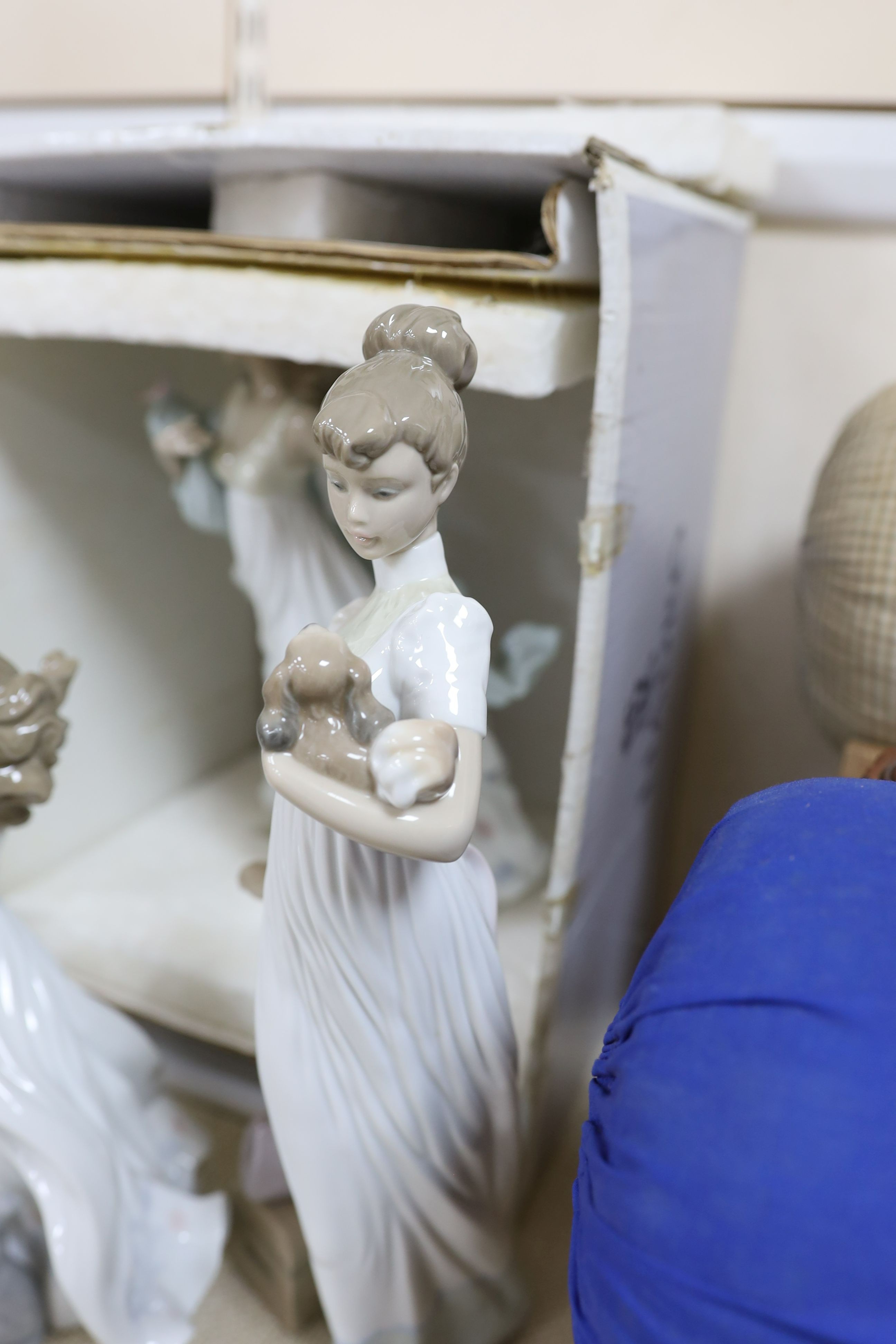 A selection of Lladro and Nao figures